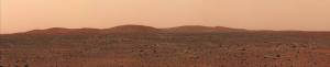Wide view of Mars horizon from surface with hills in distance