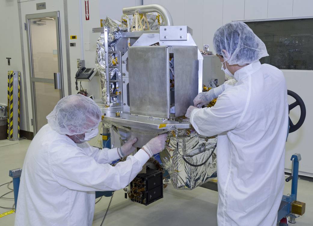 Technicians prep the OCO-2 instrument for shipping at JPL