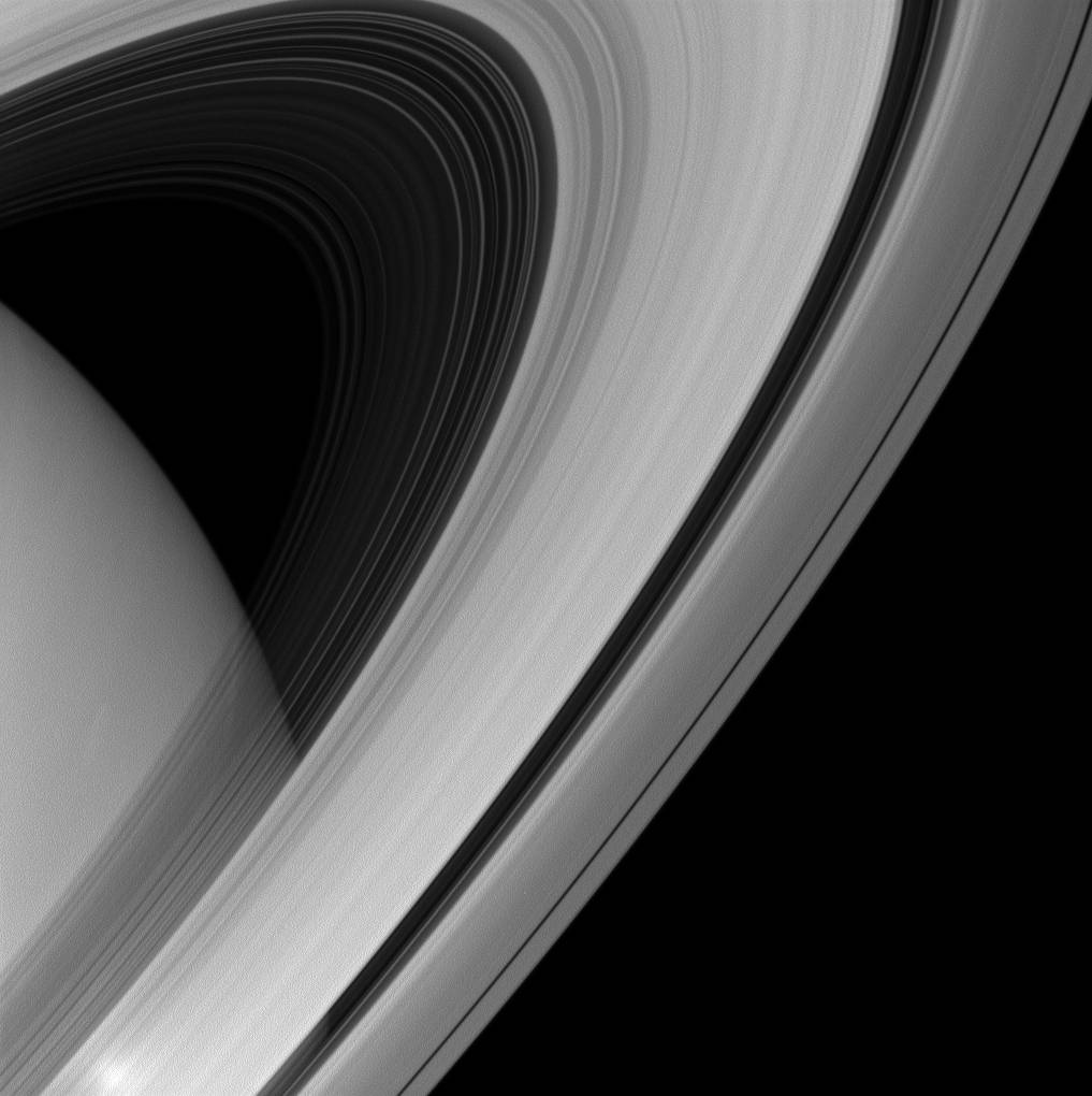 Saturn's rings appear to form a majestic arc over the planet in this image from NASA's Cassini spacecraft. Image Credit: NASA/JP