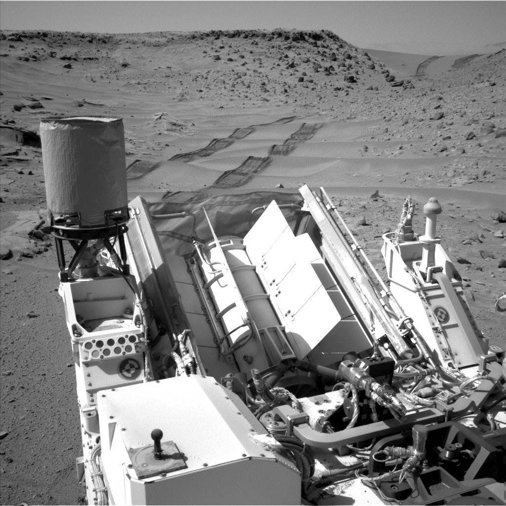 NASA's Curiosity Mars rover used the Navigation Camera (Navcam) on its mast to catch this look-back eastward at wheel tracks