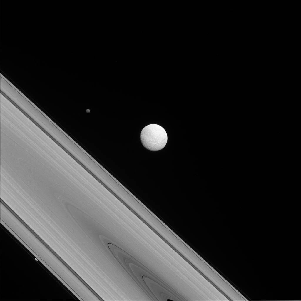 Cassini spacecraft captures a rare family photo of three of Saturn's moons 