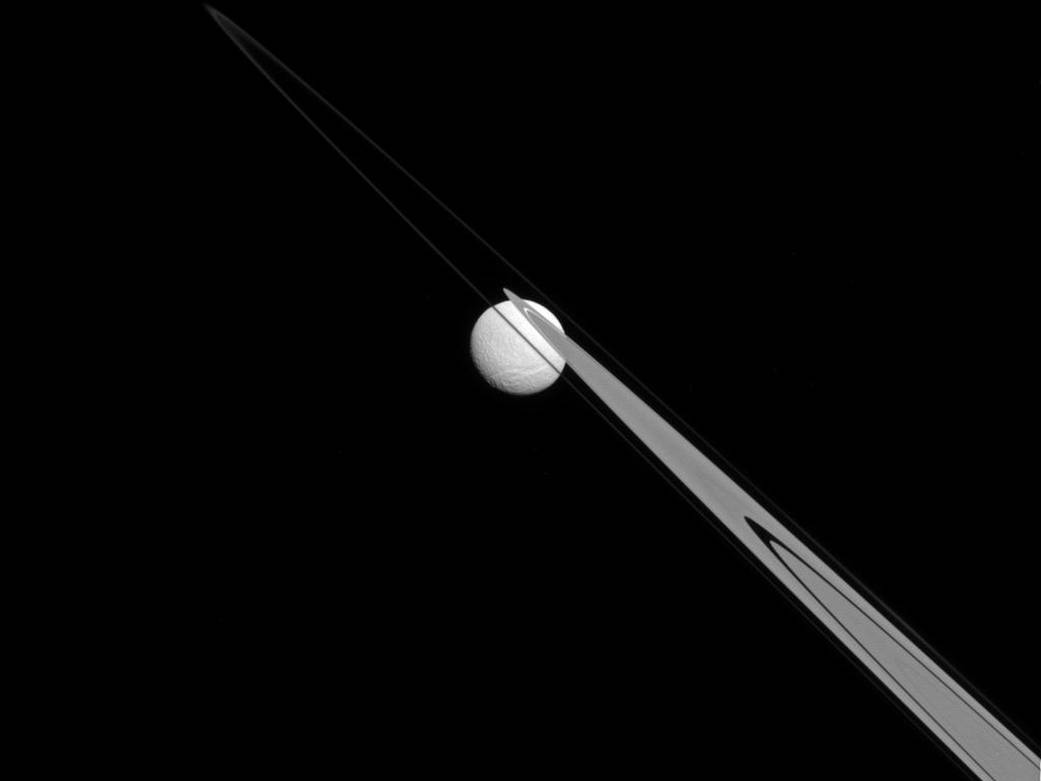 Tethys appears to be stuck to Saturn's A and F rings from this perspective.