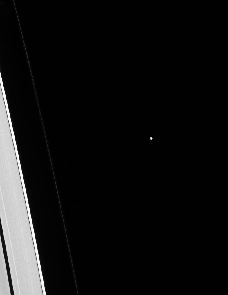 Epimetheus is dwarfed by adjacent slivers of the A and F rings