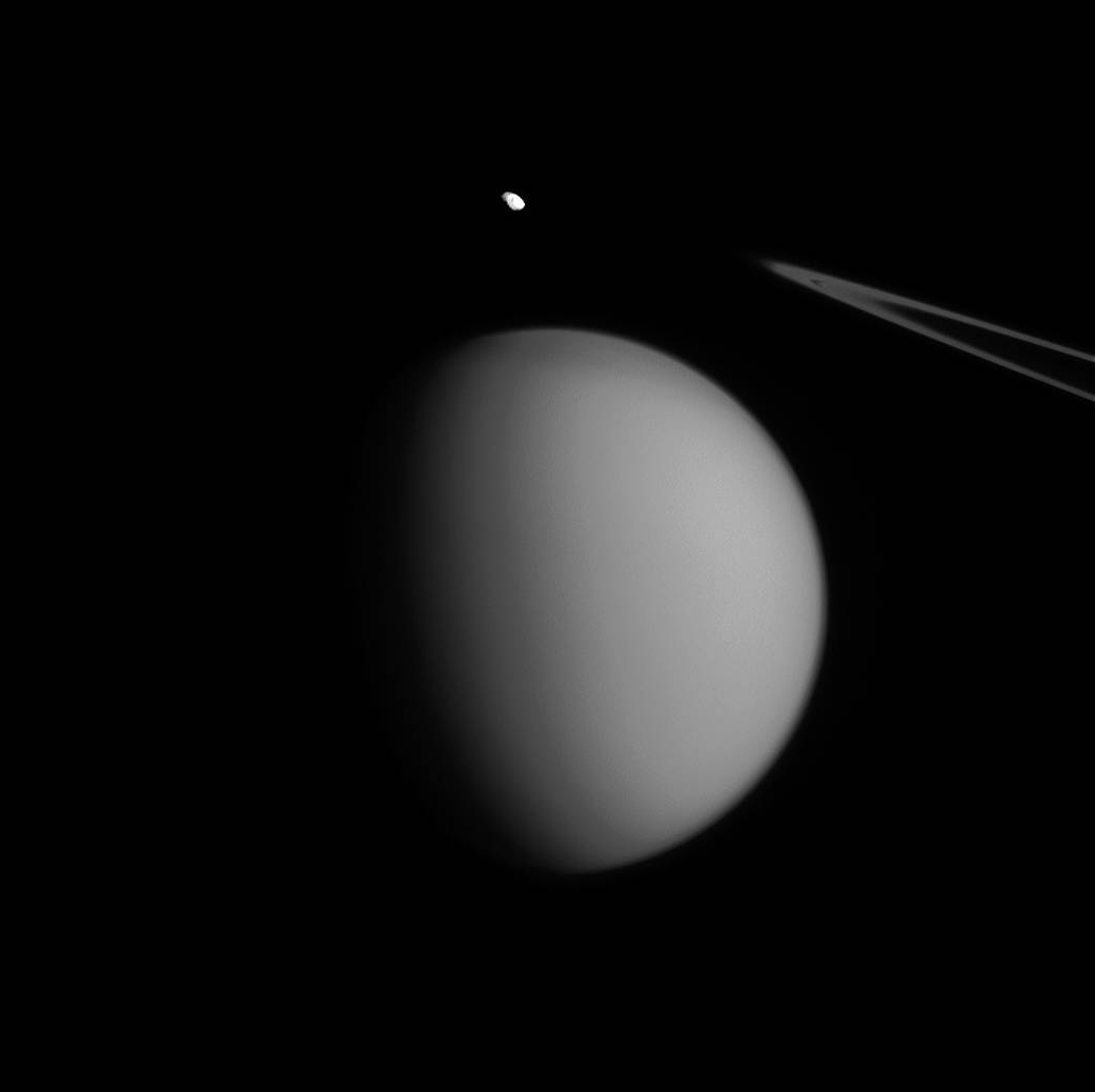 A coincidence of viewing angle makes Pandora appear to be hovering over Titan, almost like an accent mark.