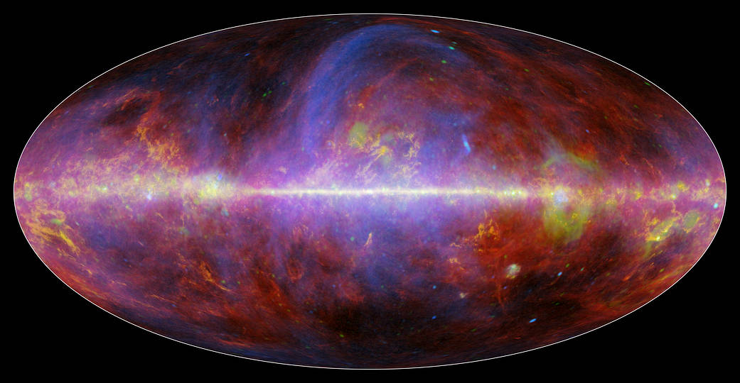 A festive portrait of our Milky Way galaxy shows a mishmash of gas, charged particles and several types of dust