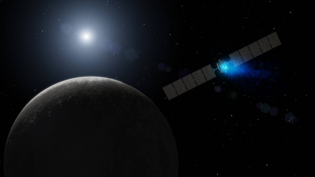 This artist's concept shows NASA's Dawn spacecraft arriving at the dwarf planet Ceres