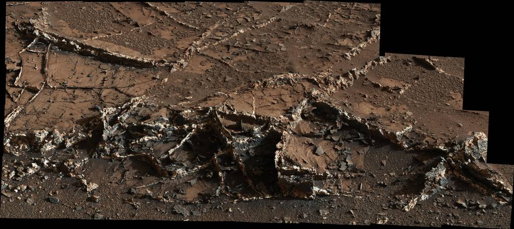 Closeup image of Mars terrain with mineral veins and rocks