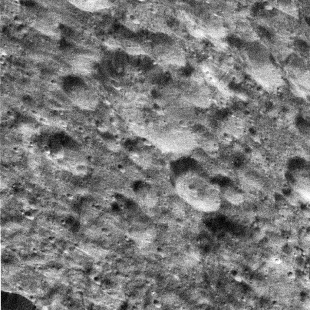 Dione’s Saturn-lit Surface
