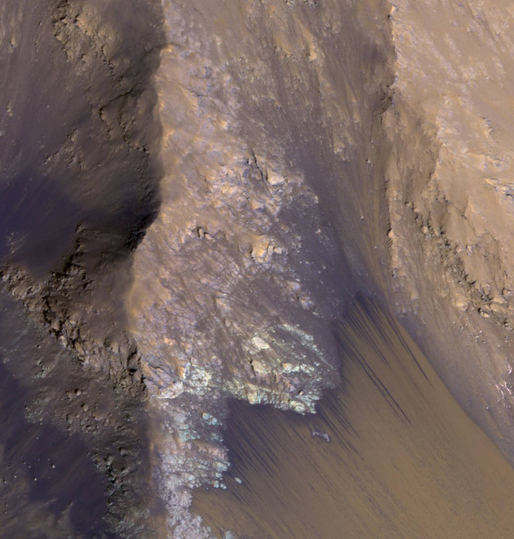 This July 21, 2015, image from the orbiter's HiRISE camera shows examples within Mars' Valles Marineris.