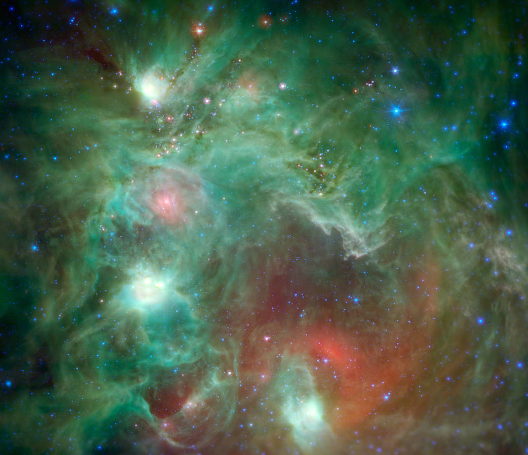 Scores of baby stars shrouded by dust are revealed in this infrared image of the star-forming region NGC 2174