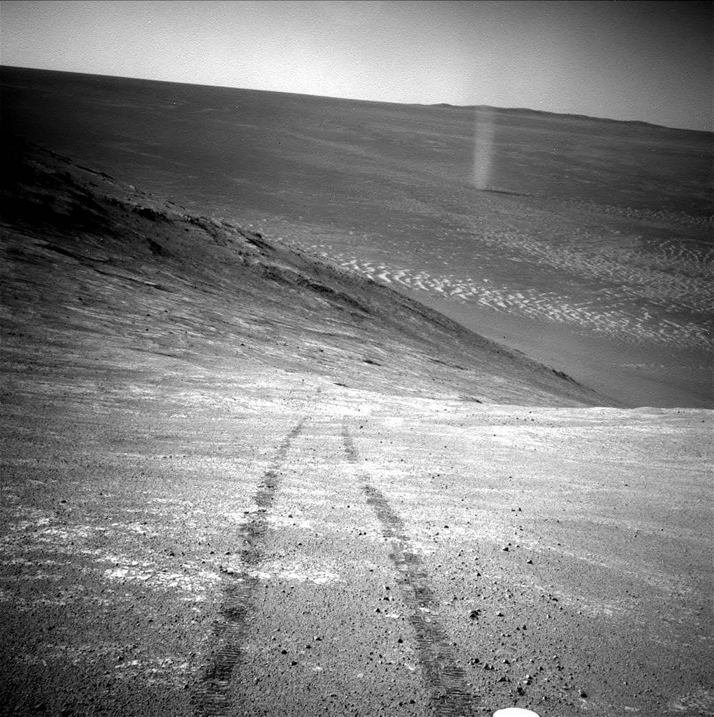 Dust devil on MarsFrom its perch high on a ridge, NASA's Mars Exploration Rover Opportunity recorded this image of a Martian dus