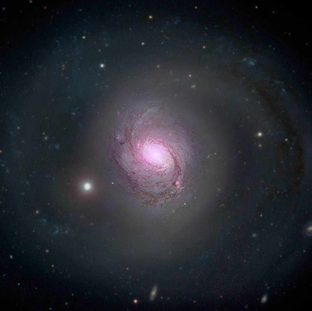 Spiral galaxy in space with supermassive black hole at center