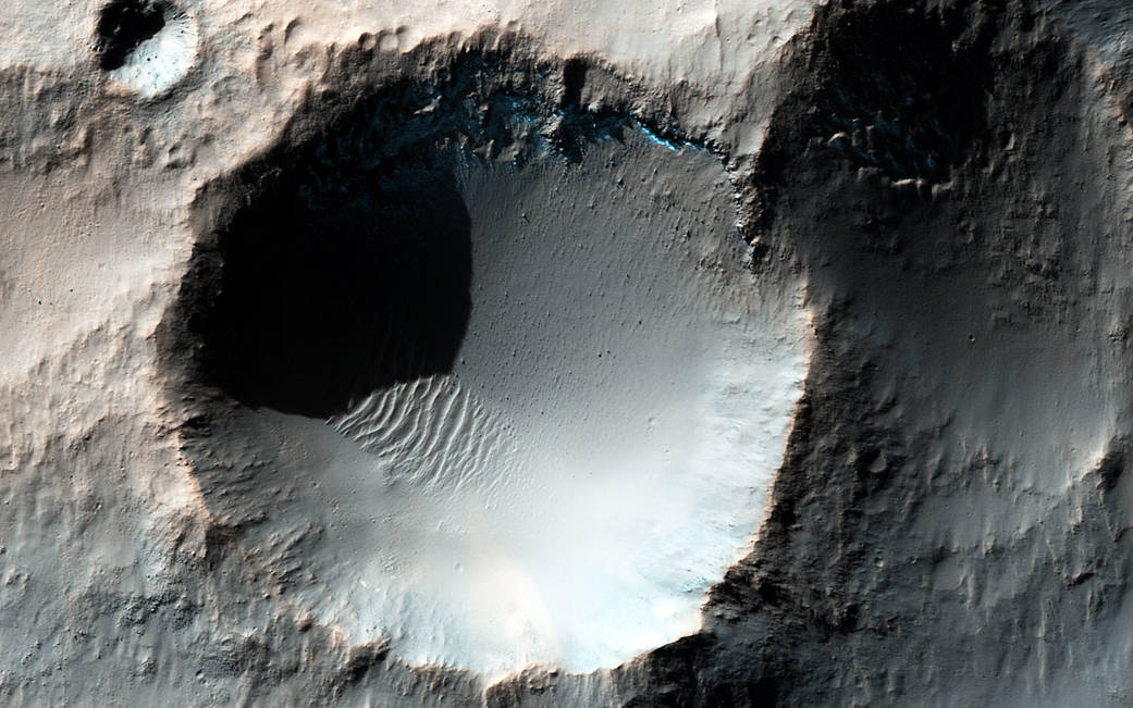 Enhanced color HiRISE image shows several craters in the southern mid-latitudes of Mars