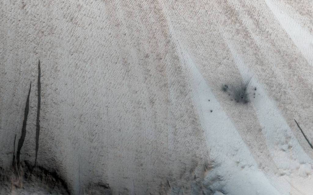A New Crater on a Dusty Slope