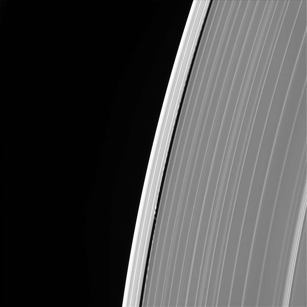 Saturn rings closeup with moon visible