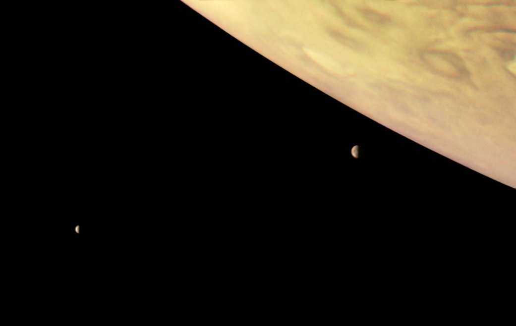 Jupiter and two of its largest moons – Io and Europa 