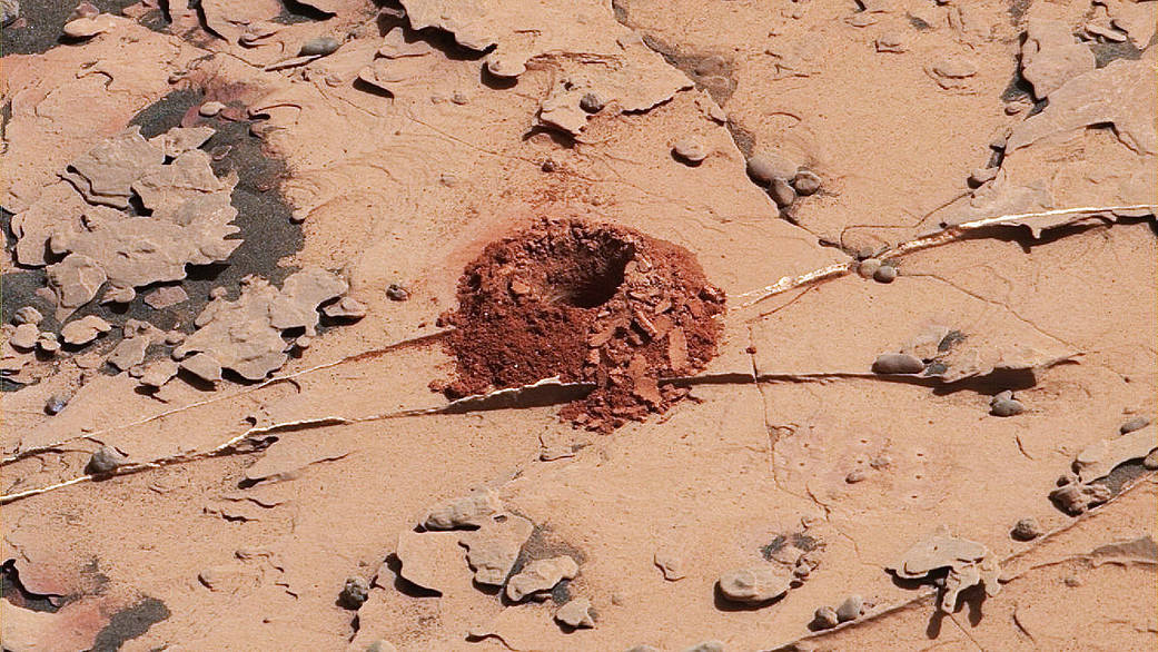 A close-up image of a 2-inch-deep hole produced using a new drilling technique for NASA's Curiosity rover