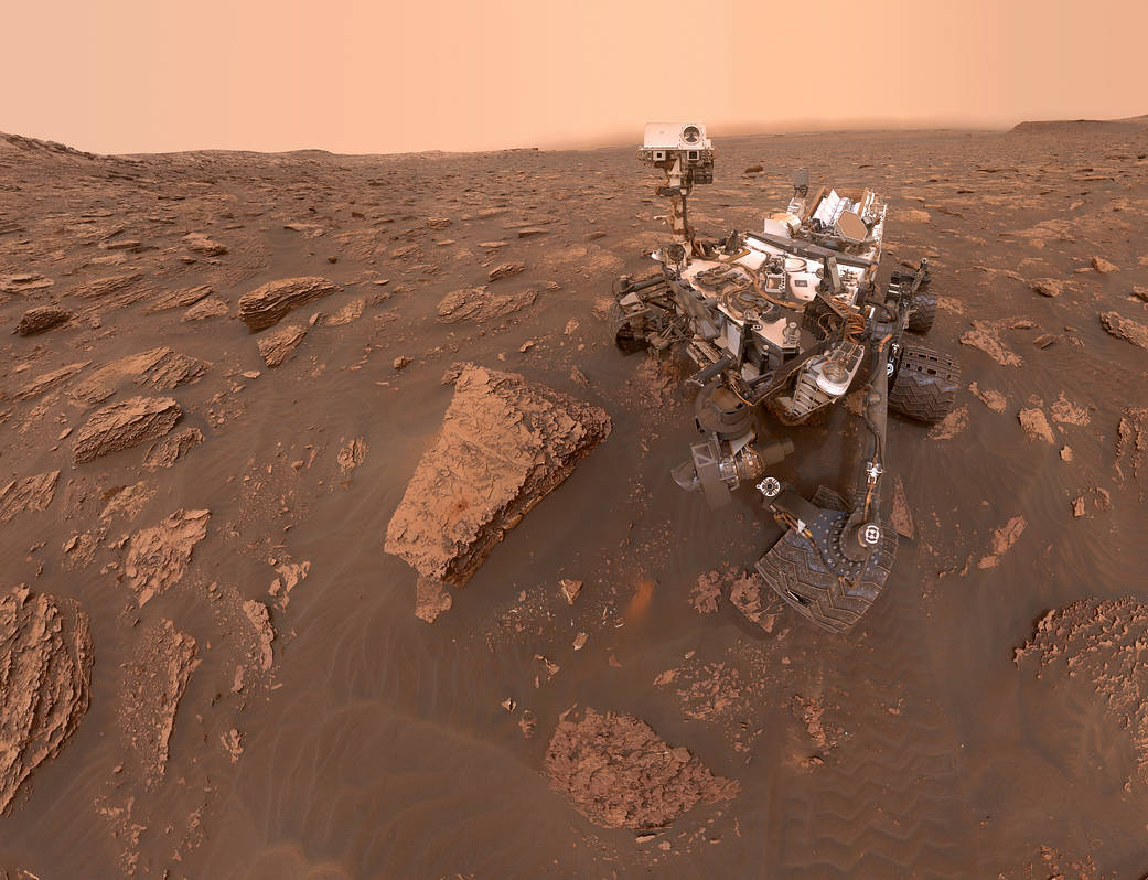 image of rover on Mars with rocks