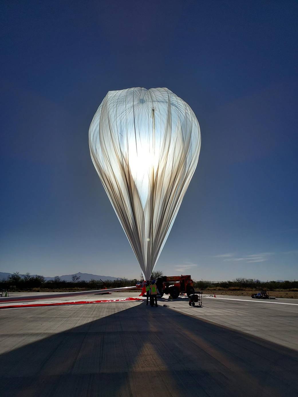 World View’s Stratollite high-altitude balloon is inflated on the launch pad.