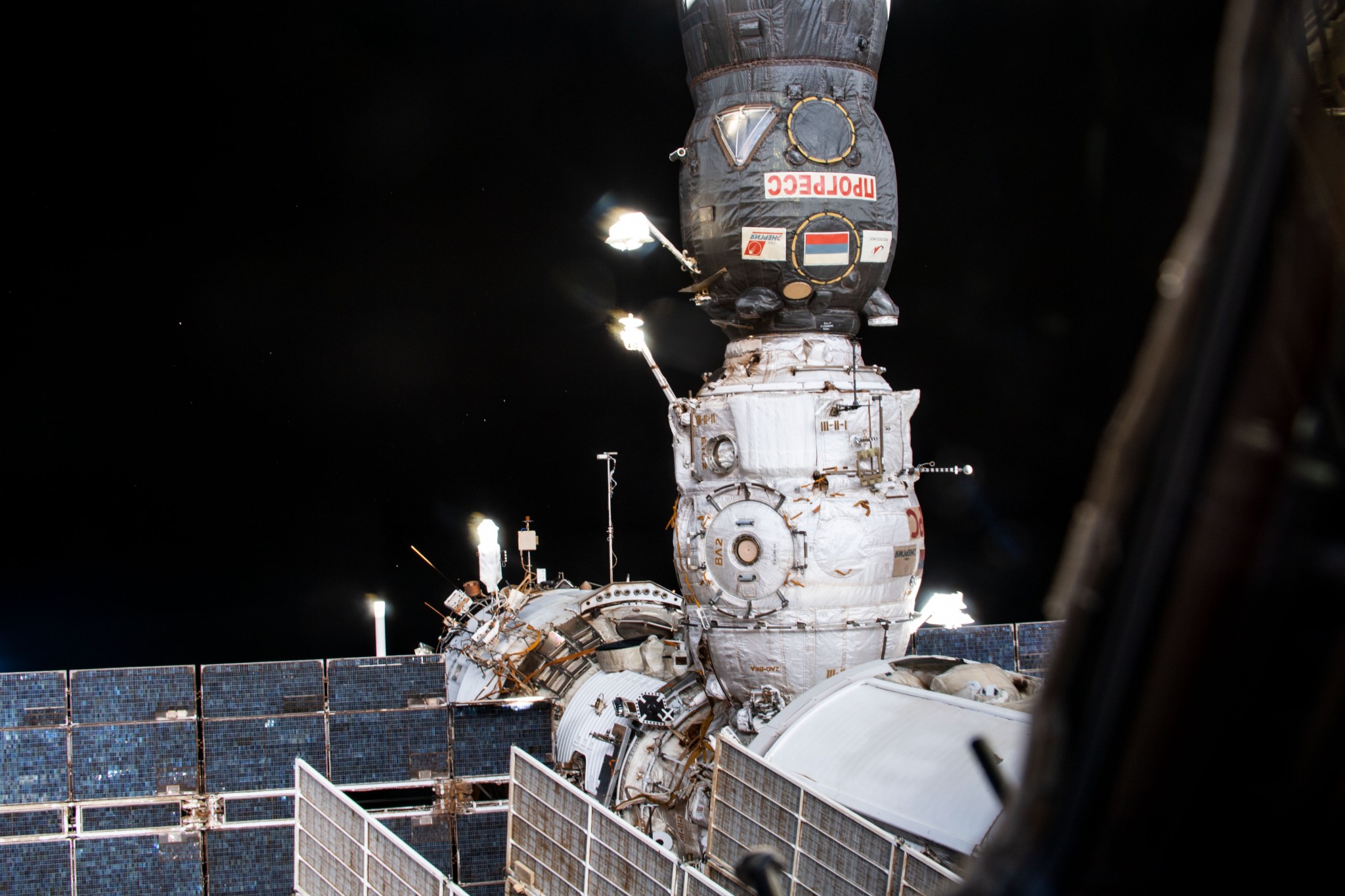The Pirs docking compartment, with the ISS Progress 77 cargo craft docked to it, is pictured attached to Earth-facing port of the International Space Station's Zarya service module.