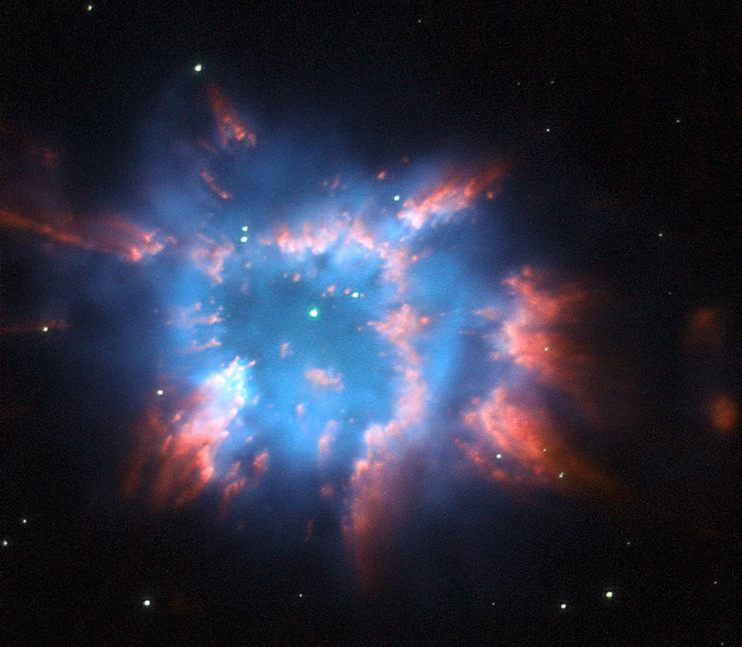 bright nebula in blue with pink clouds