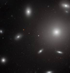 white blobs of stars around on big one