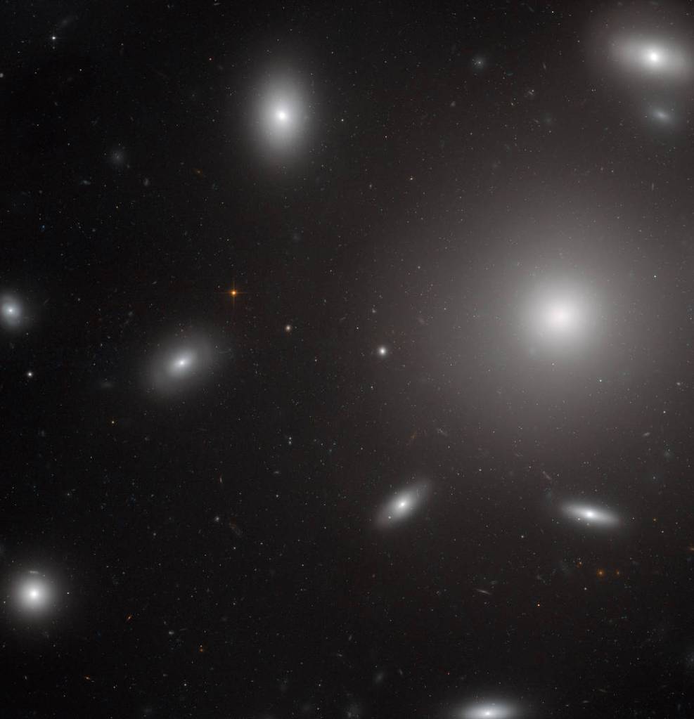 white blobs of stars around on big one