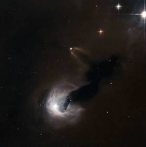 Hubble Space Telescope image showing a small young stellar object in the early stages of its life, surrounded by a bright disk o