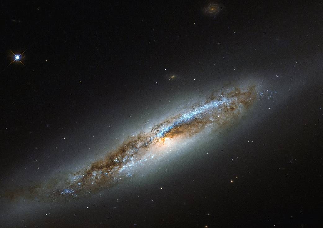 diagonal edge-on spiral galaxy with dark portions