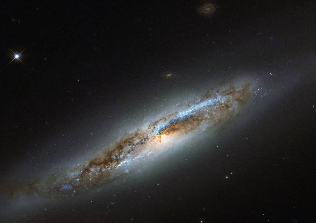 diagonal edge-on spiral galaxy with dark portions