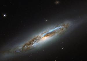 diagonal edge-on spiral galaxy with dark portions