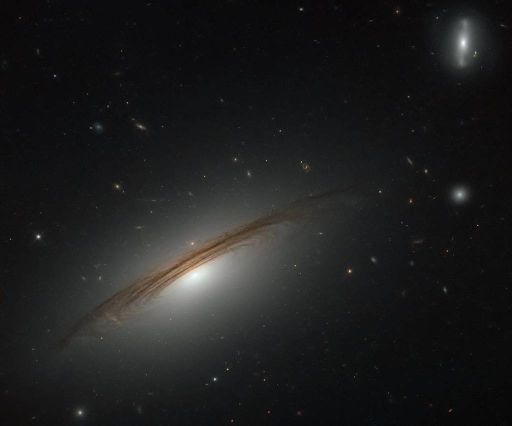 wispy dark spirals outline a galaxy