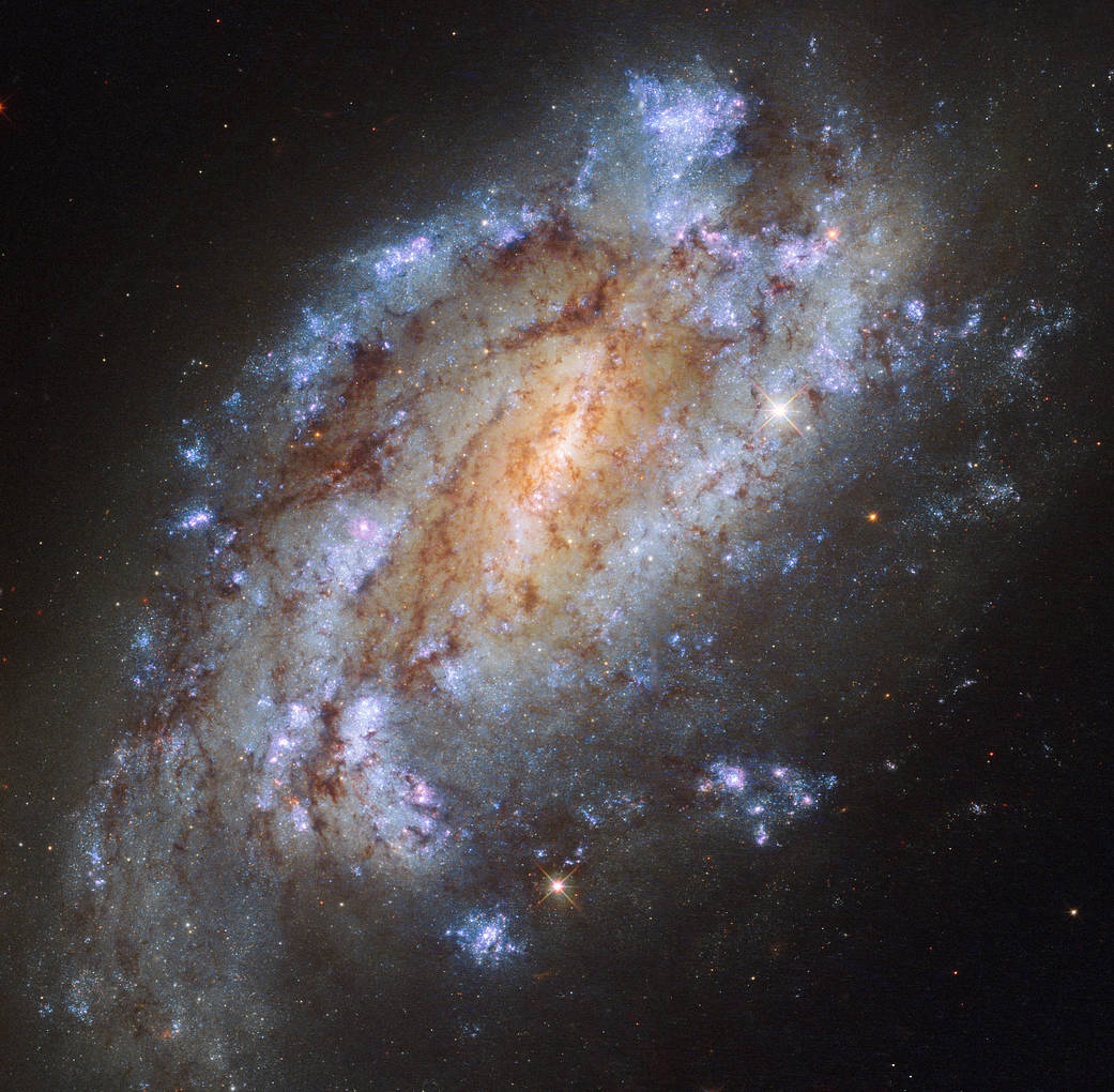 a bright, ragged spiral galaxy