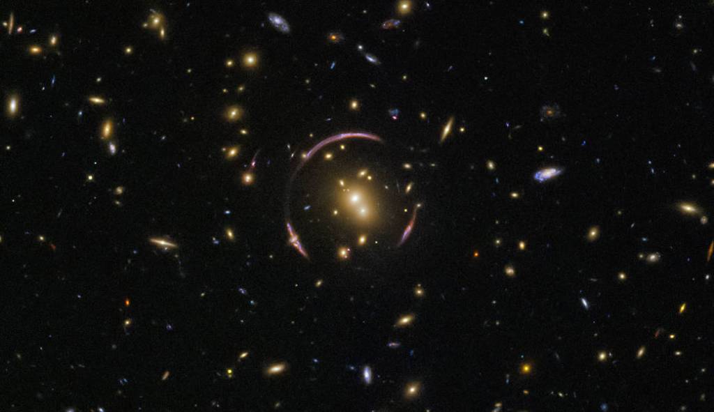 pink broken ring circling a cluster of galaxies