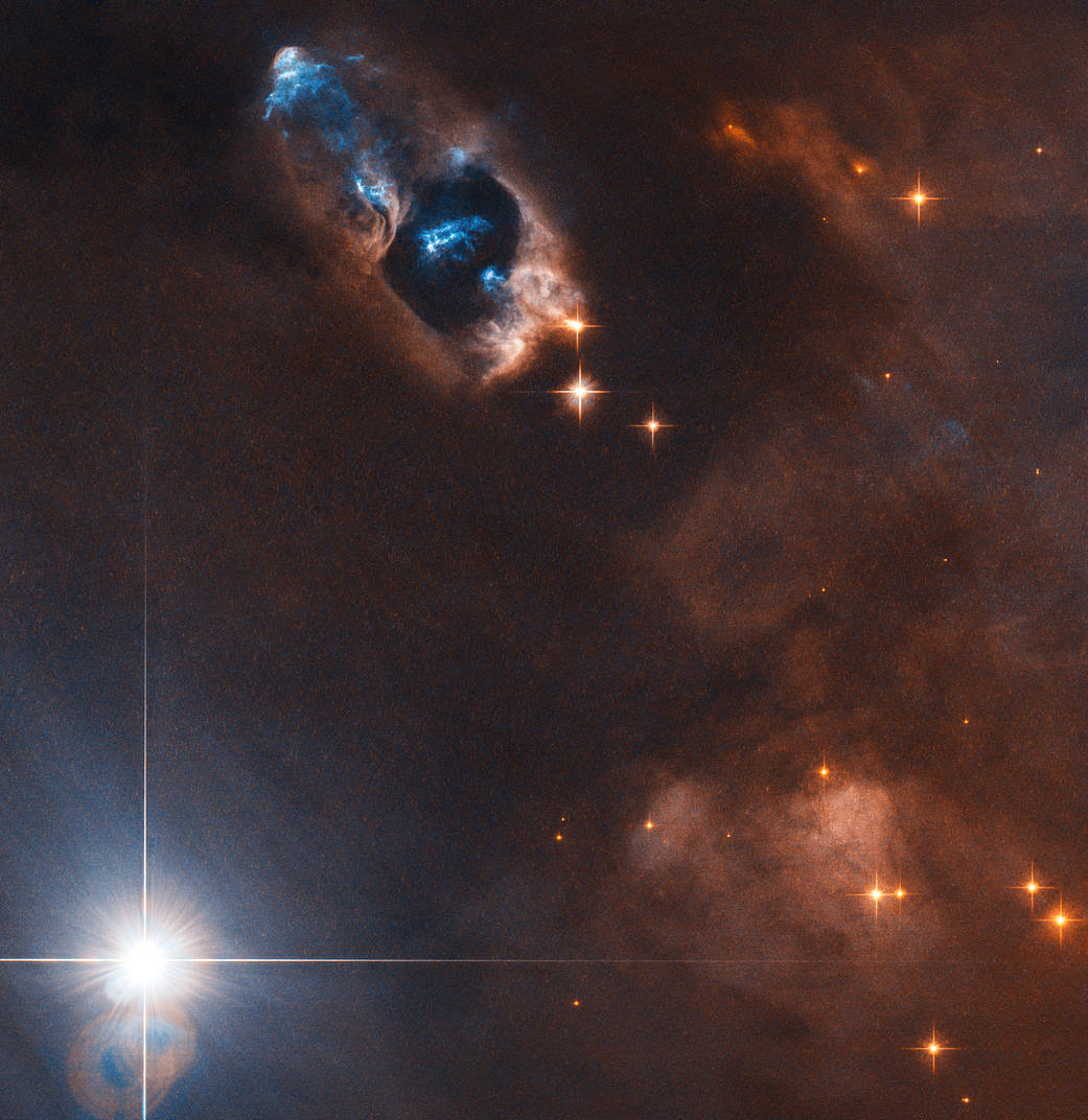 bright objects pierce a hole in a ruddy nebula
