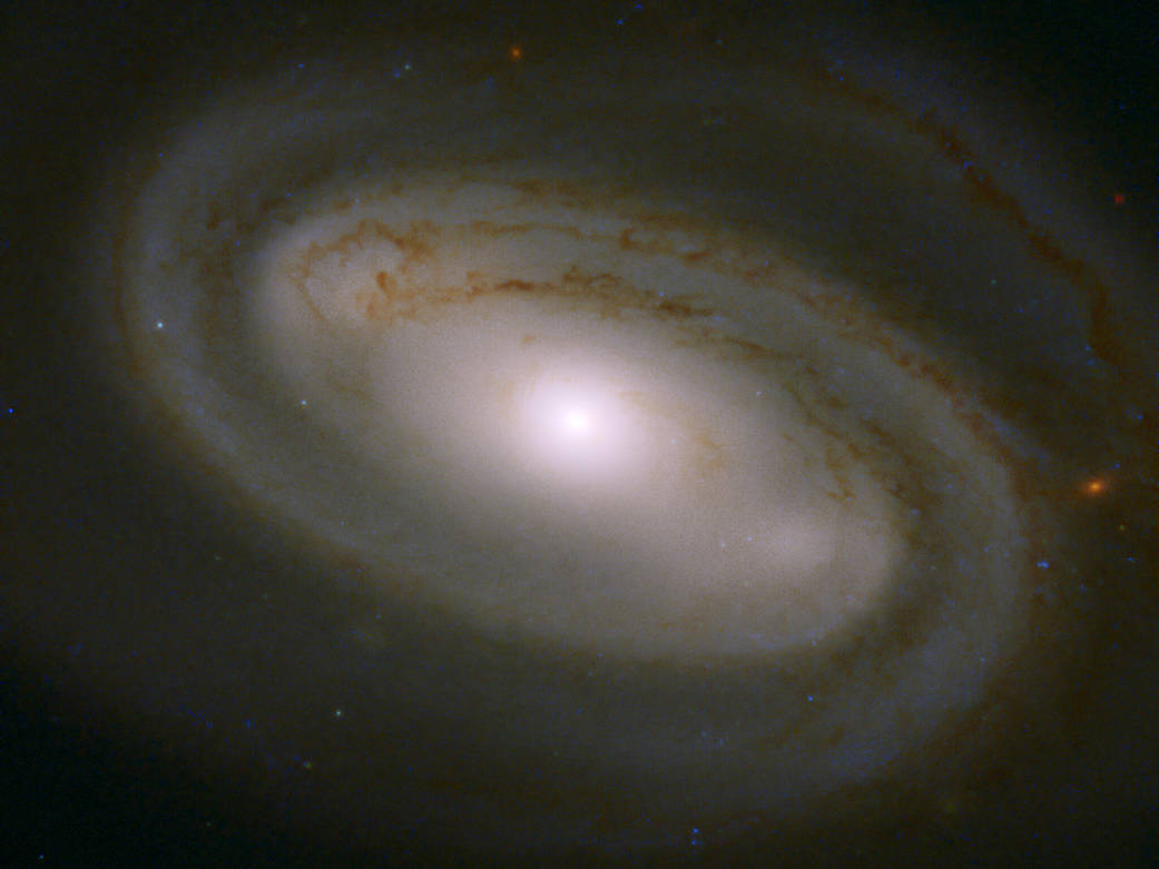 light, glowing spiral galaxy NGC 3895 as seen by Hubble