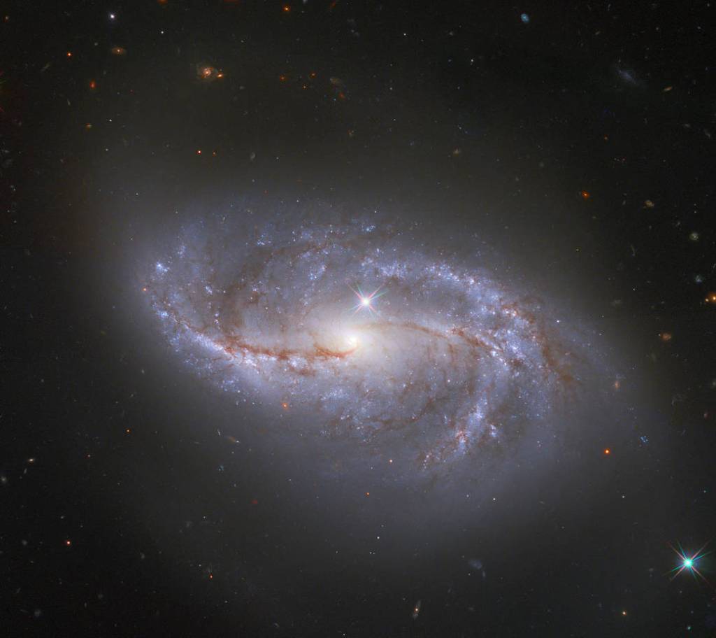 bright spiral galaxy NGC 2608 against the black backdrop of space
