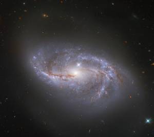 bright spiral galaxy NGC 2608 against the black backdrop of space