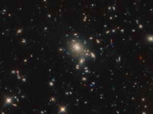 starburst galaxy PLCK G045.1+61.1 (a bunch of bright smears of light against the black backdrop of space)