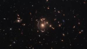 This NASA/ESA Hubble Space Telescope image features the galaxy LRG-3-817, also known as SDSS J090122.37+181432.3.