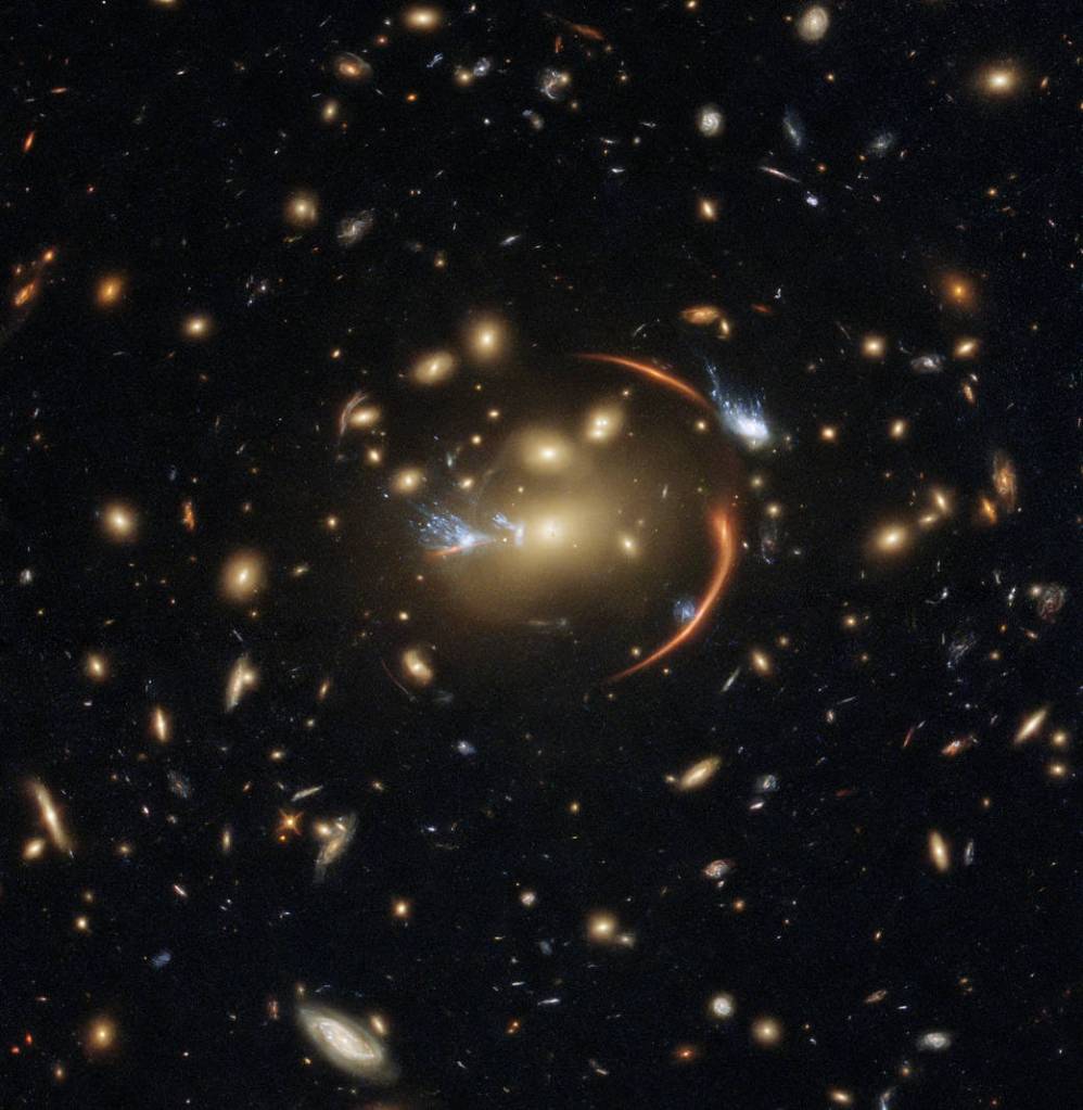 The center of this image from the NASA/ESA Hubble Space Telescope is framed by the tell-tale arcs that result from strong gravitational lensing.