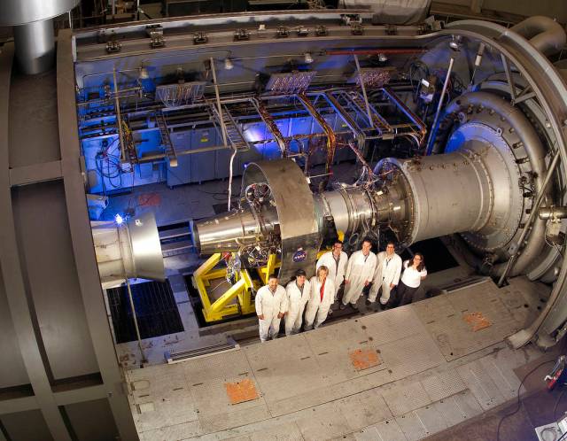 Technicians set up a jet engine for testing in the Propulsion Systems Laboratory at NASA Glenn.