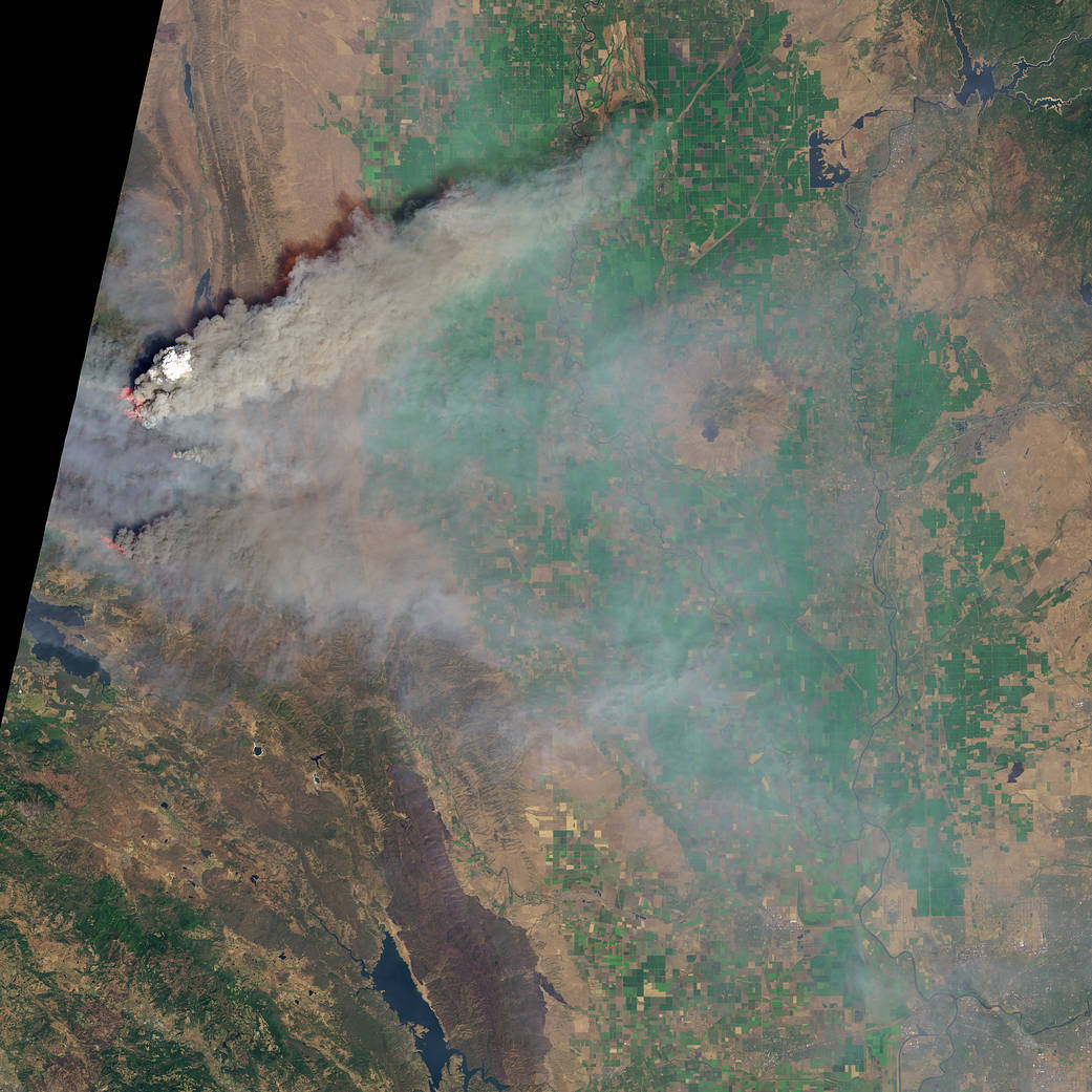 Satellite image of smoke plume and flames in California