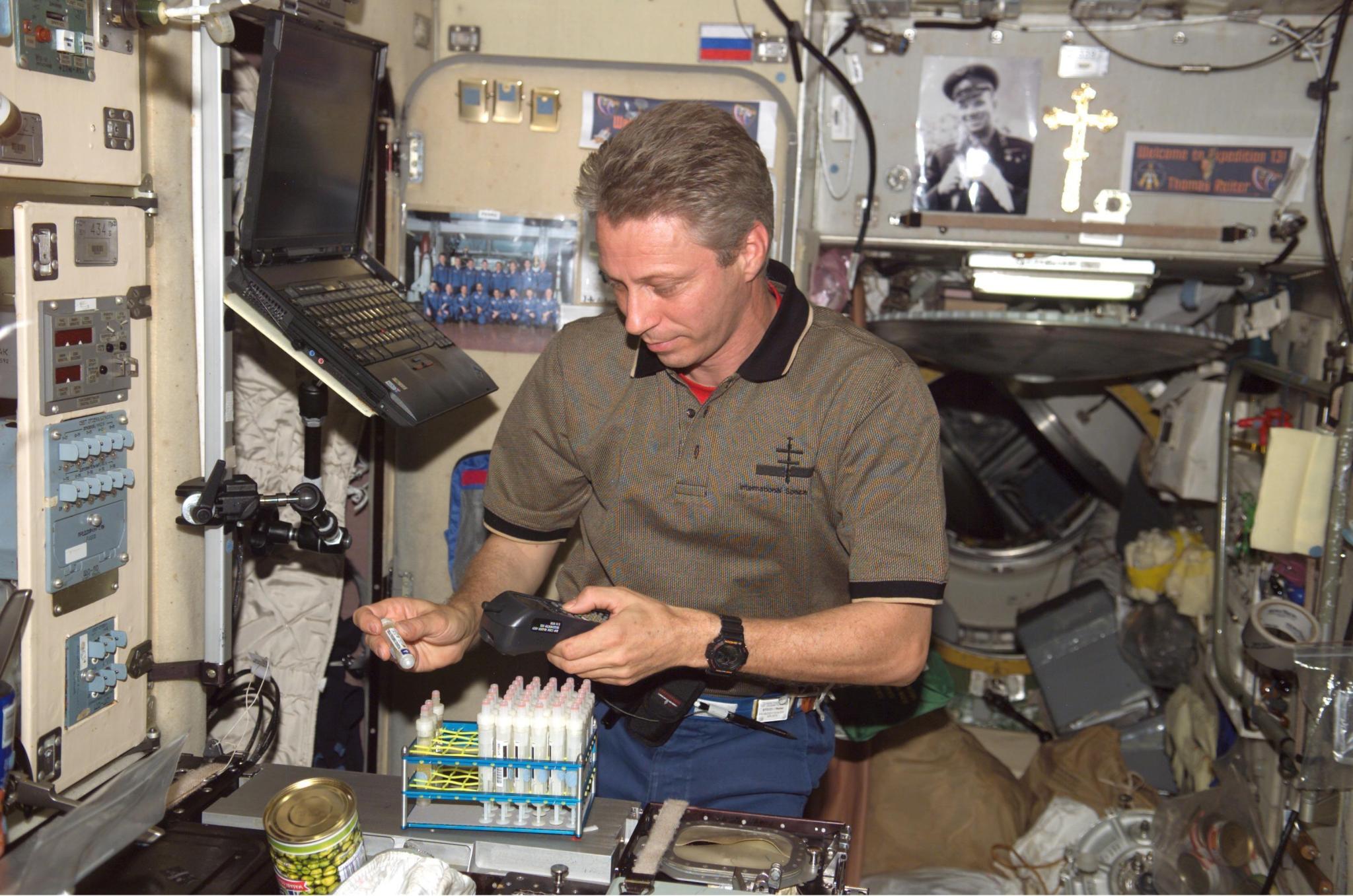 astronaut on ISS processes samples for the Renal Stone investigation