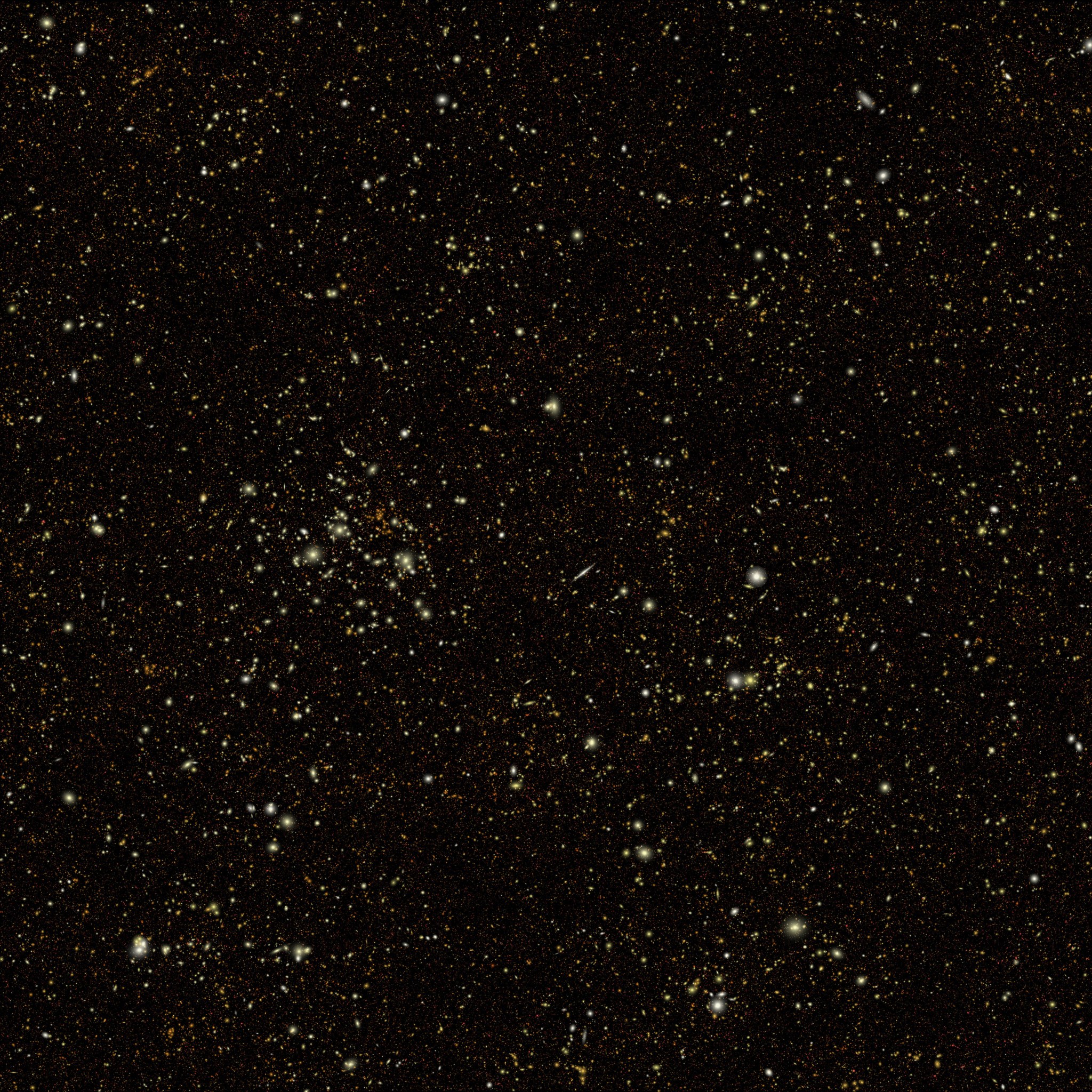 A black background is speckled with millions of tiny dots. The smallest ones are red, and slightly larger ones are yellow and white. The larger ones are occasionally surrounded by glows when they're particularly big, and some have blob-like shapes.
