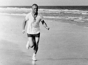Mercury astronaut John Glenn stays fit by running on the beach in Cape Canaveral, Florida.
