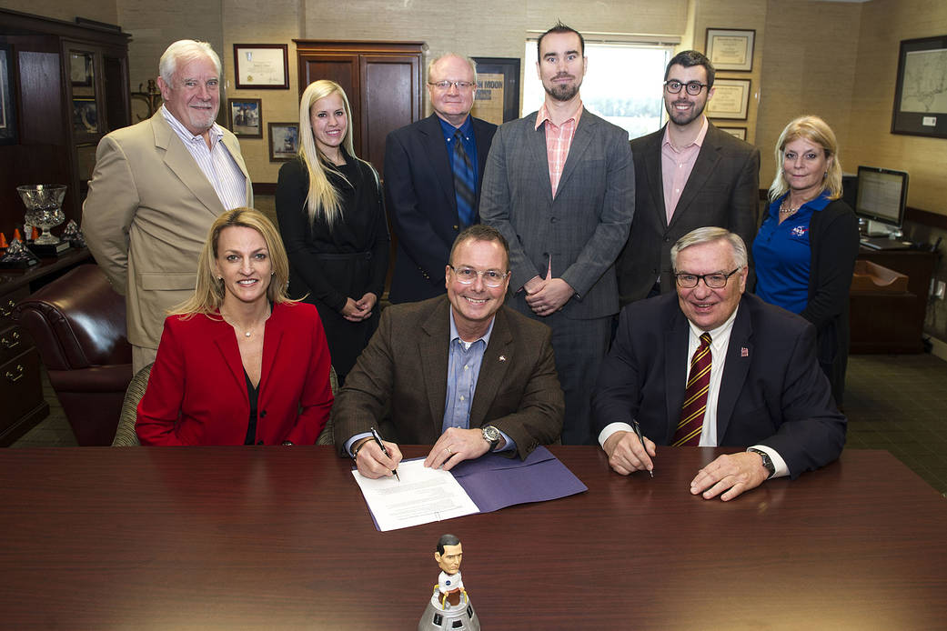 SSC Center Director Rick Gilbrech (seated, center) welcomed Bill Locander, dean of the College of Business at Loyola University.