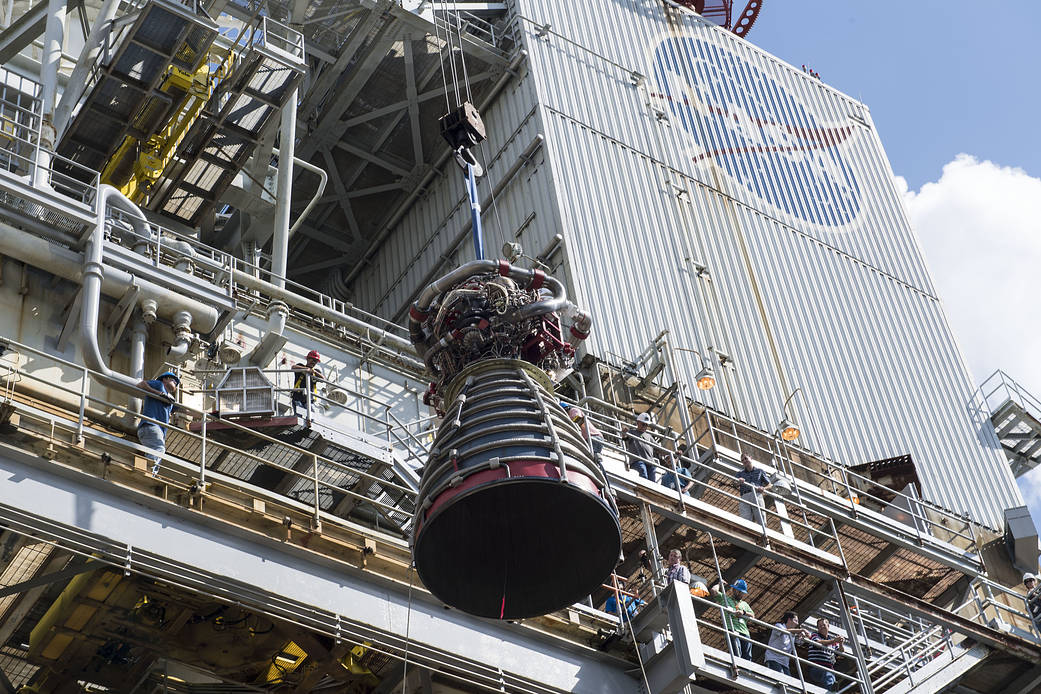 RS-25 flight engine E2063 is lifted into place onto the A-1 Test Stand 