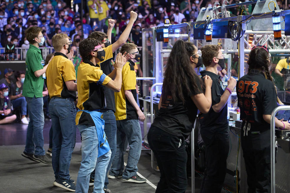 Teams are shown competing in the FIRST (For Inspiration and Recognition of Science and Technology) Robotics World Championship in Houston, Texas in April of 2022