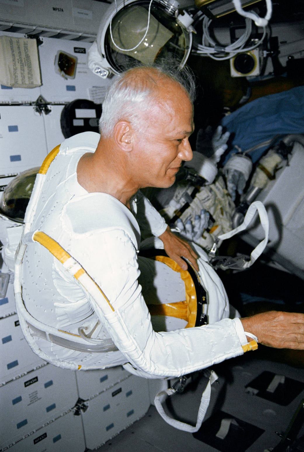 Astronaut Bruce McCandless in thermal wear inside space shuttle